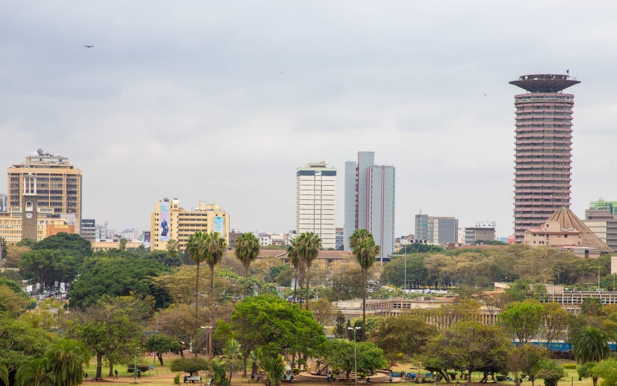 White Wooden Table and Chairs Near Body of Water in Nairobi, Kenya