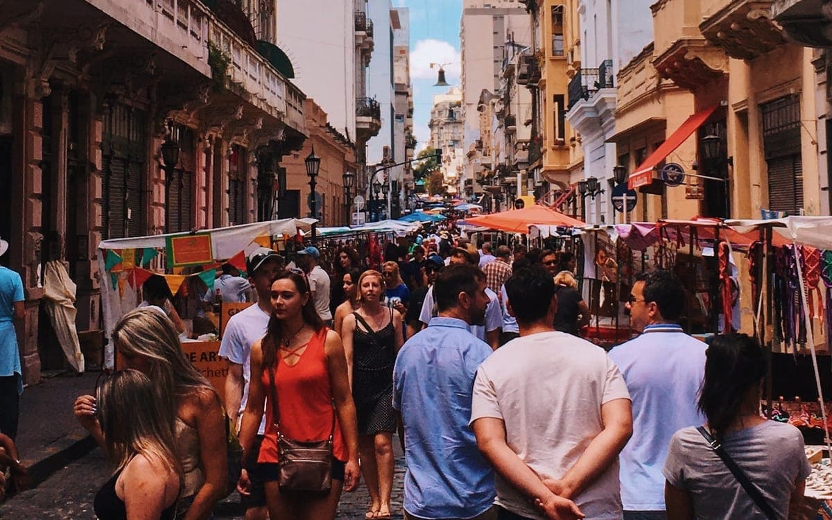 People Standing on Road Beside Market and High-rise Buildings in San Nicolas, CABA, Argentina