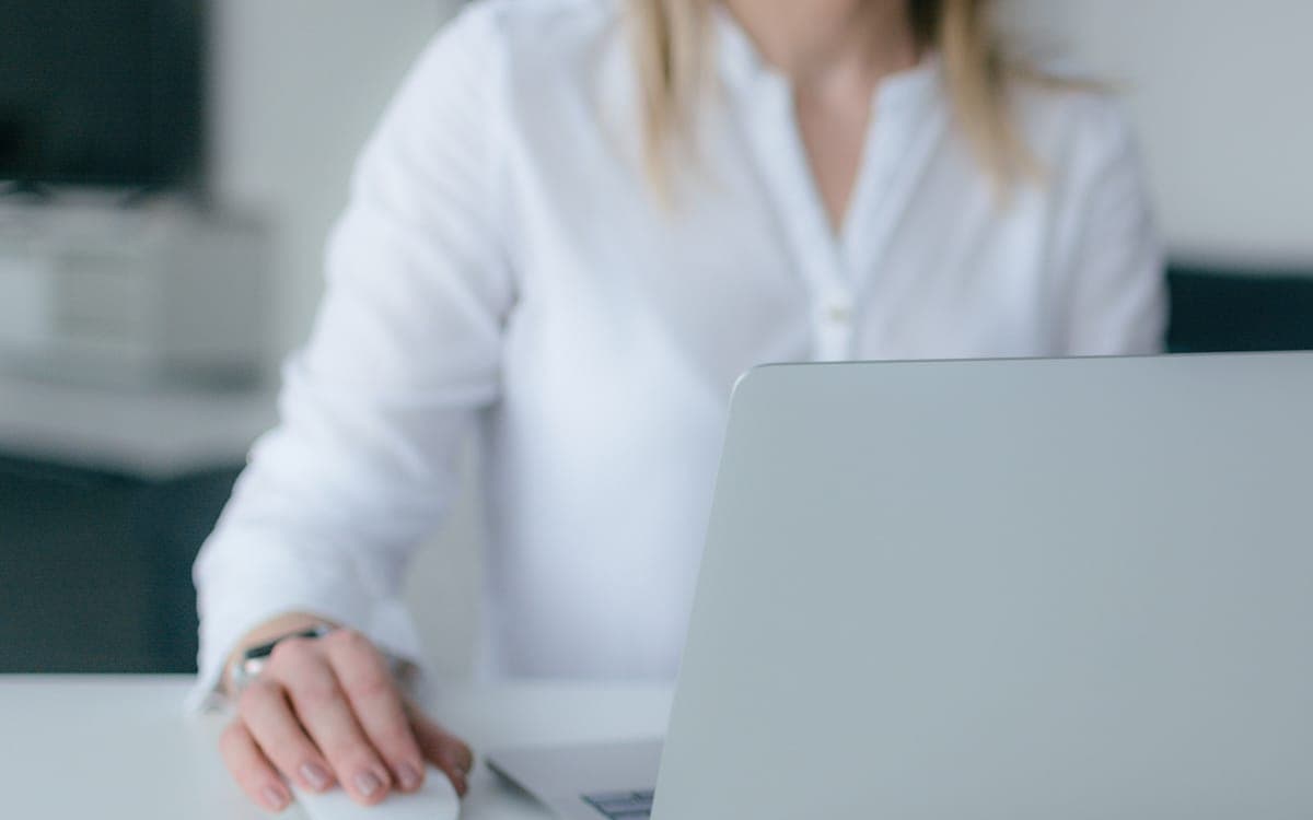 Woman Using Silver Laptop