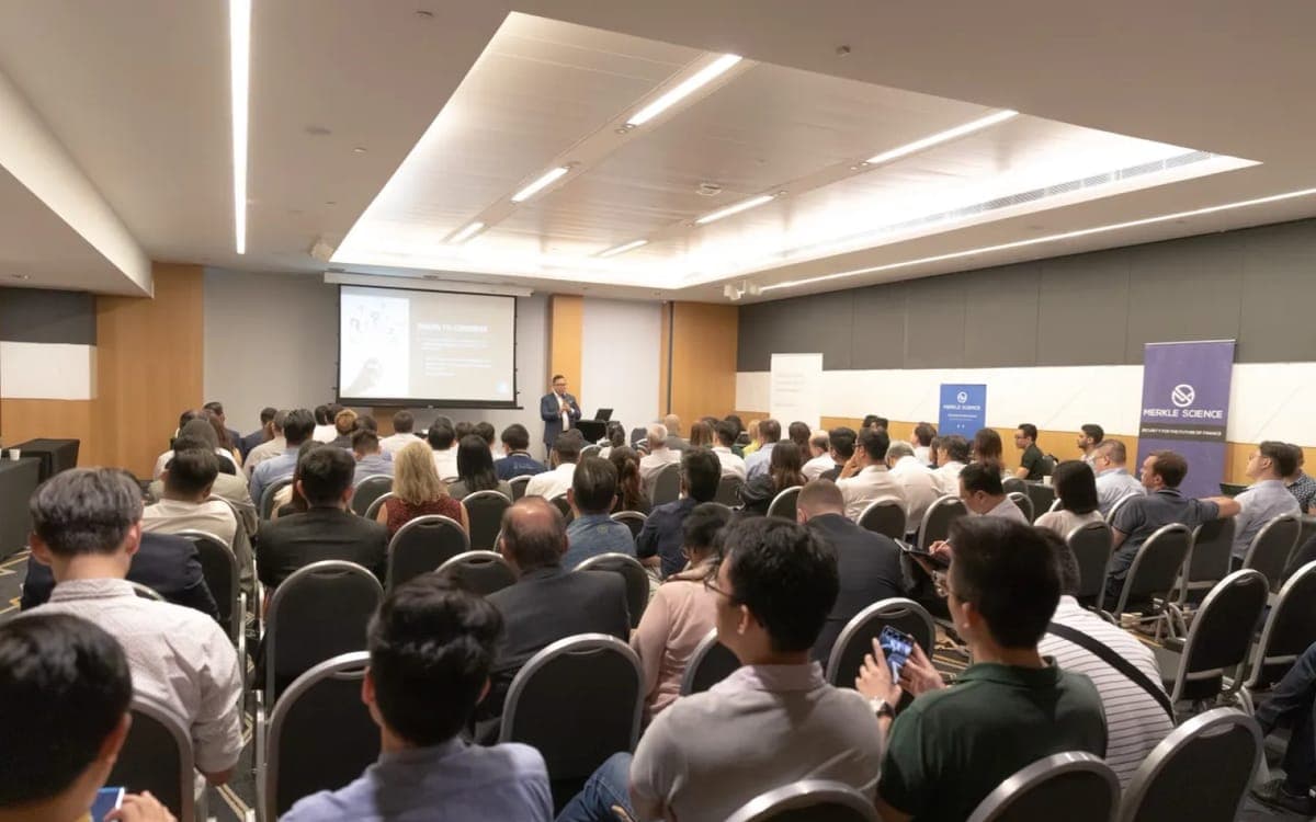 Group of people listening to a presentation for a group launch